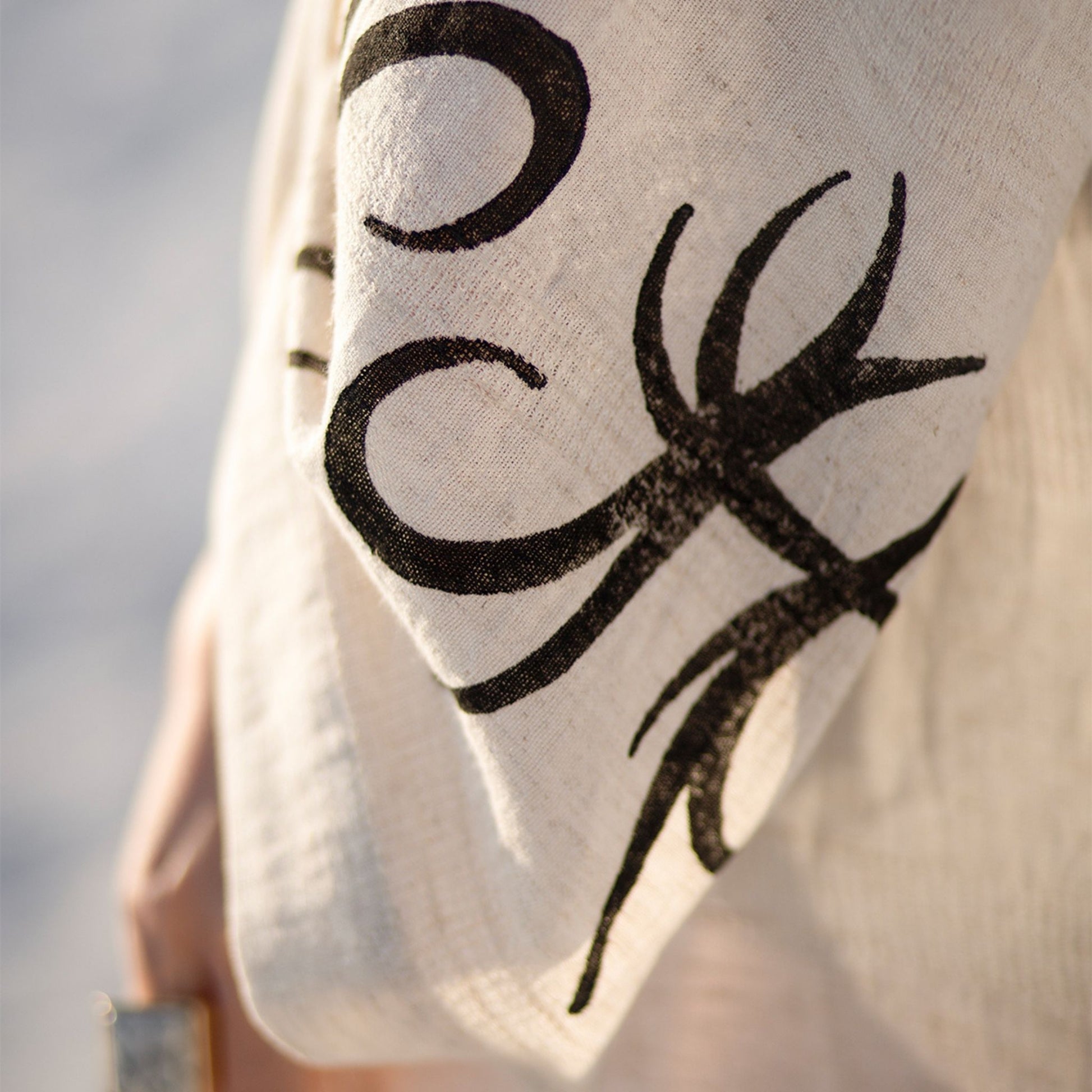 Unisex linen and hemp kimono robe with hand-block printed boho pattern, styled as beach cover-up 