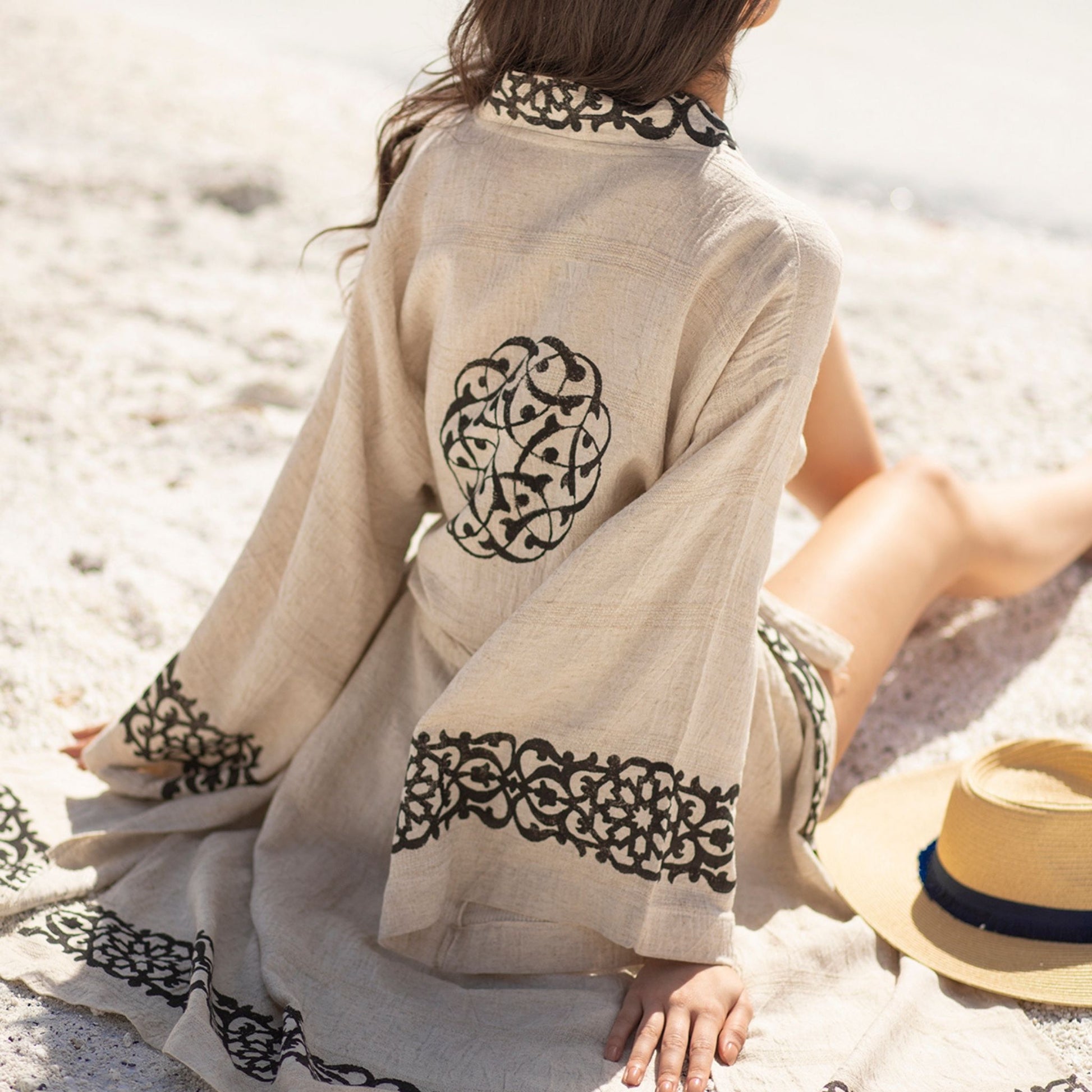 Unisex linen and hemp kimono robe with hand-block printed boho pattern, styled as beach cover-up
