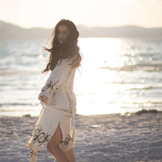 Unisex linen and hemp kimono robe with hand-block printed boho pattern, styled as beach cover-up 