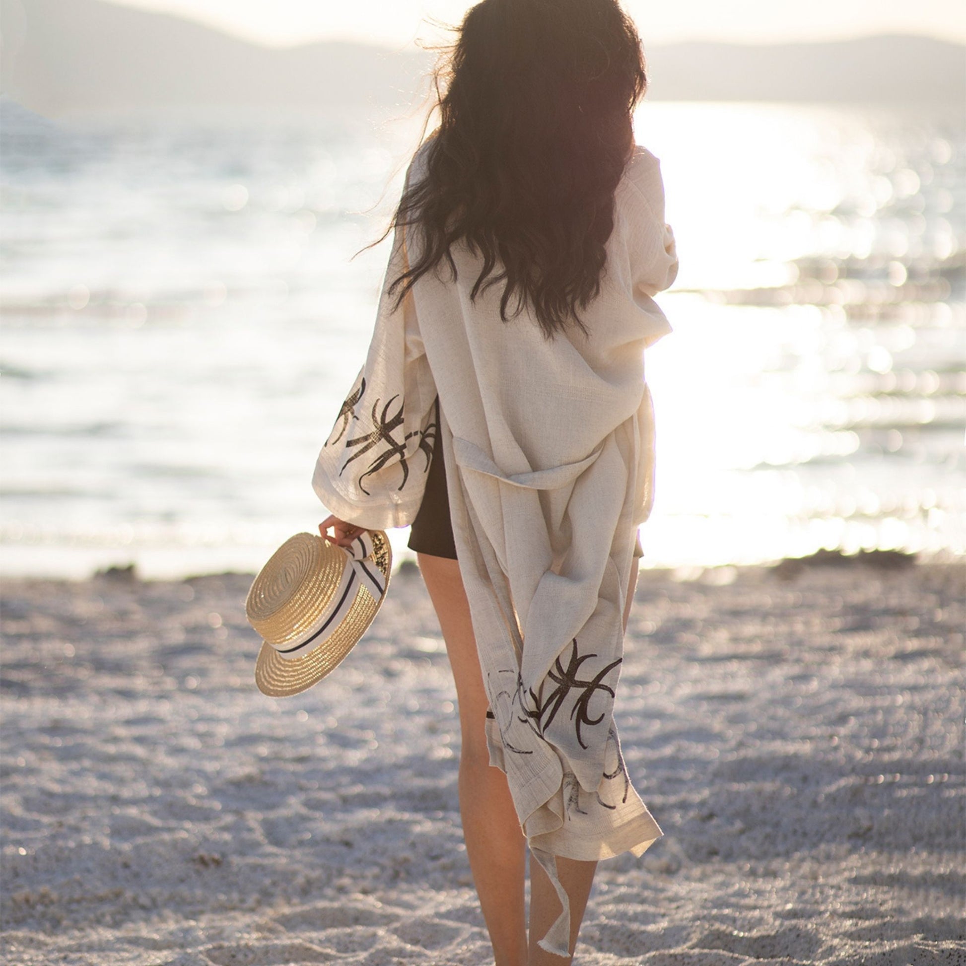 Unisex linen and hemp kimono robe with hand-block printed boho pattern, styled as beach cover-up 